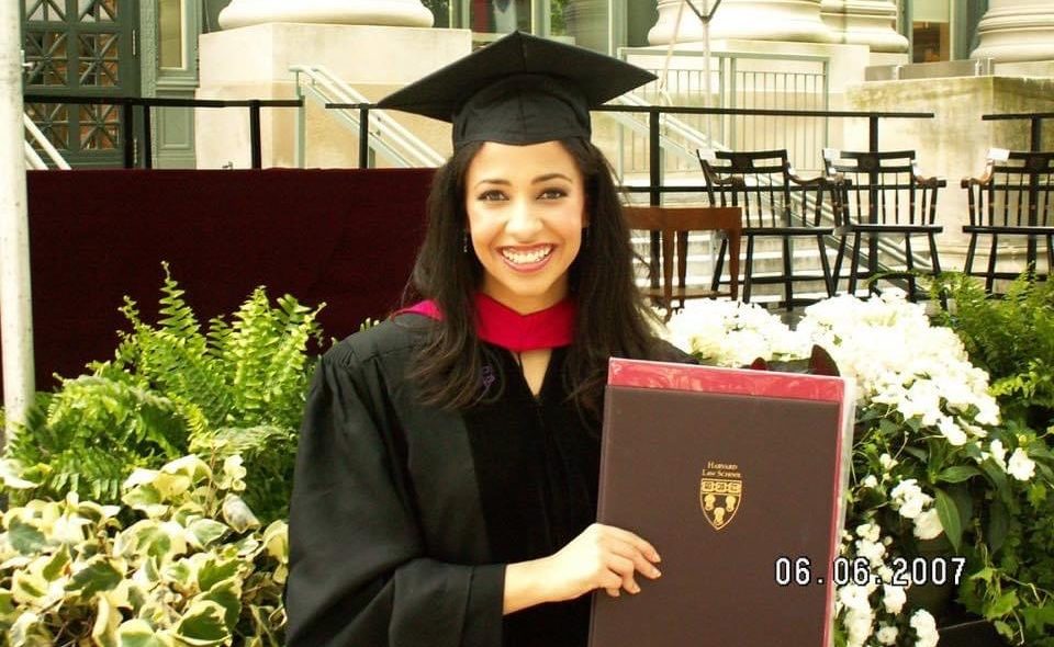 Erika Harold holding degree from Harvard Law