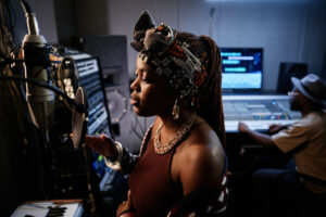 Young Black woman In recording studio