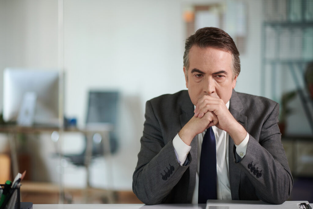 lawyer stress, Portrait of stressed tired lawyer sitting at office desk thinking about difficult case