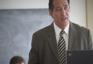 Christopher Garcia with a computer in front of him