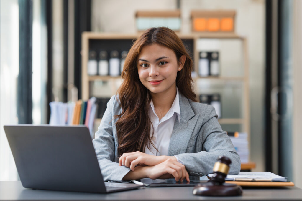 2024 law school graduates employment rate Business Lawyer consulting online on laptop while working at office..
